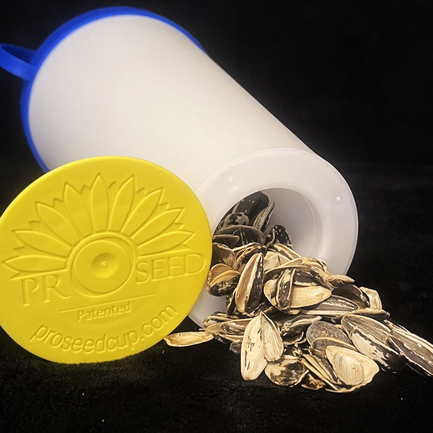 Emptying shells from the bottom of The ProSeed sunflower seed snack cup