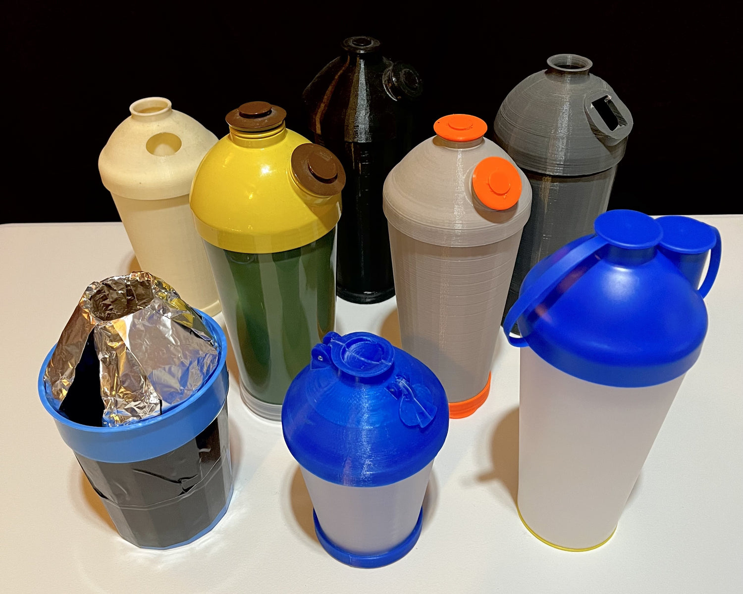 Several prototypes of the ProSeed cup in different colors.