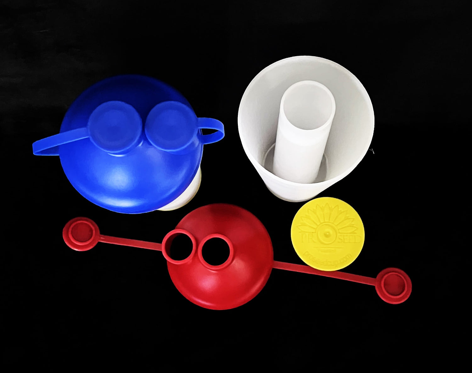 Several pieces of a ProSeed cup on a black background